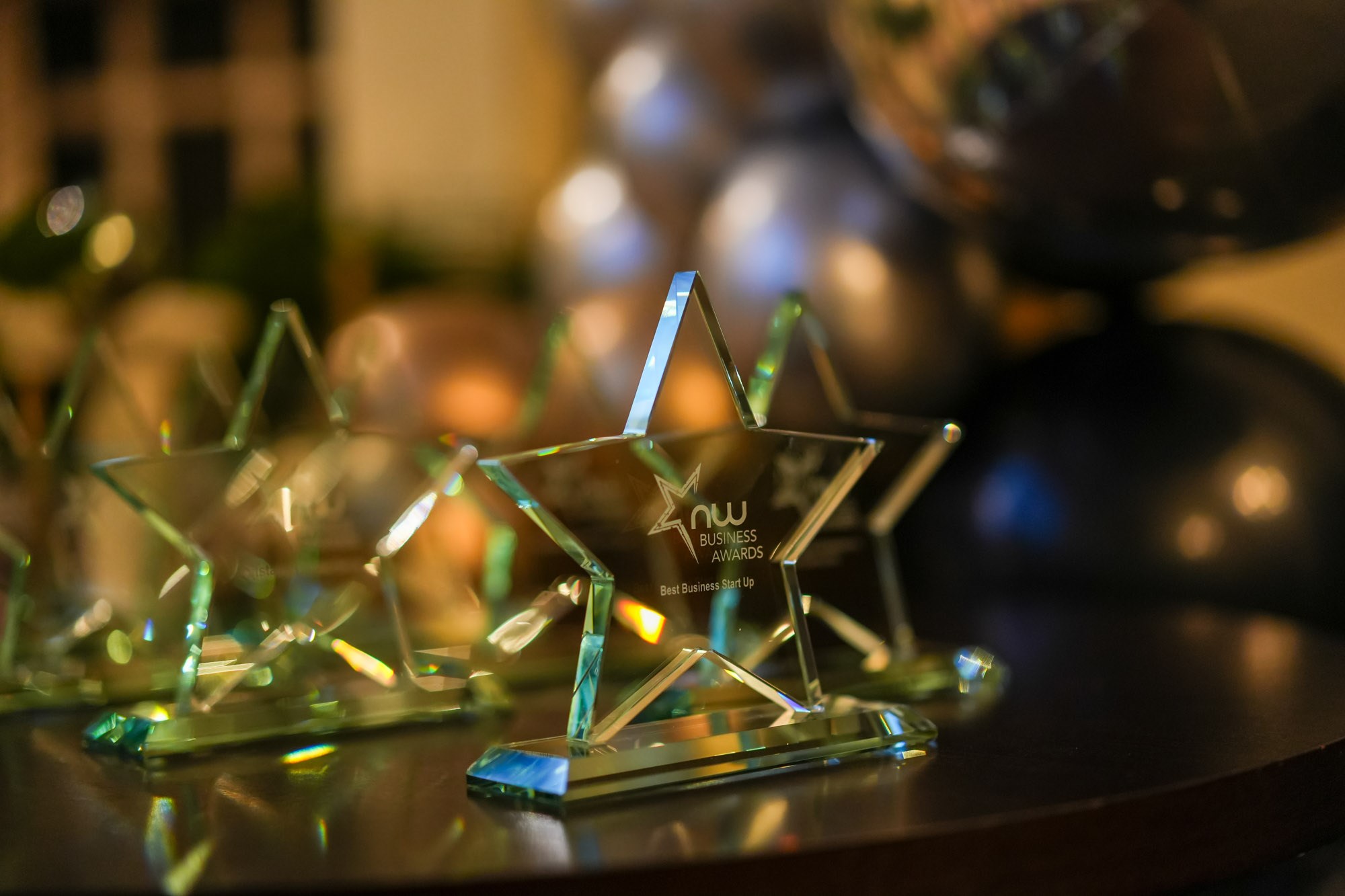 close up view of the award evening awards which are crystal glass stars