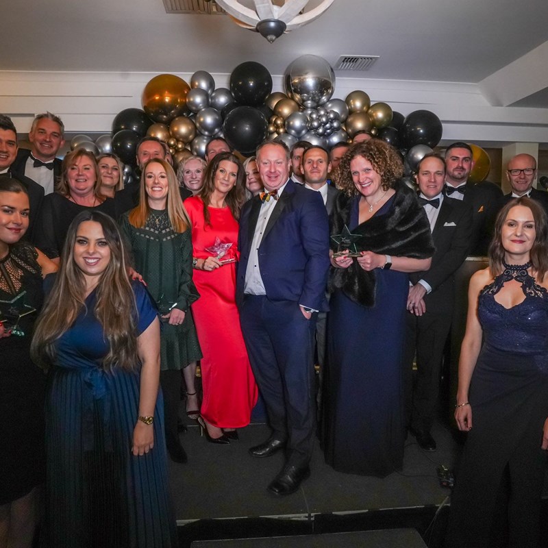 A group of people representing local business who have won awards at a ceremony.